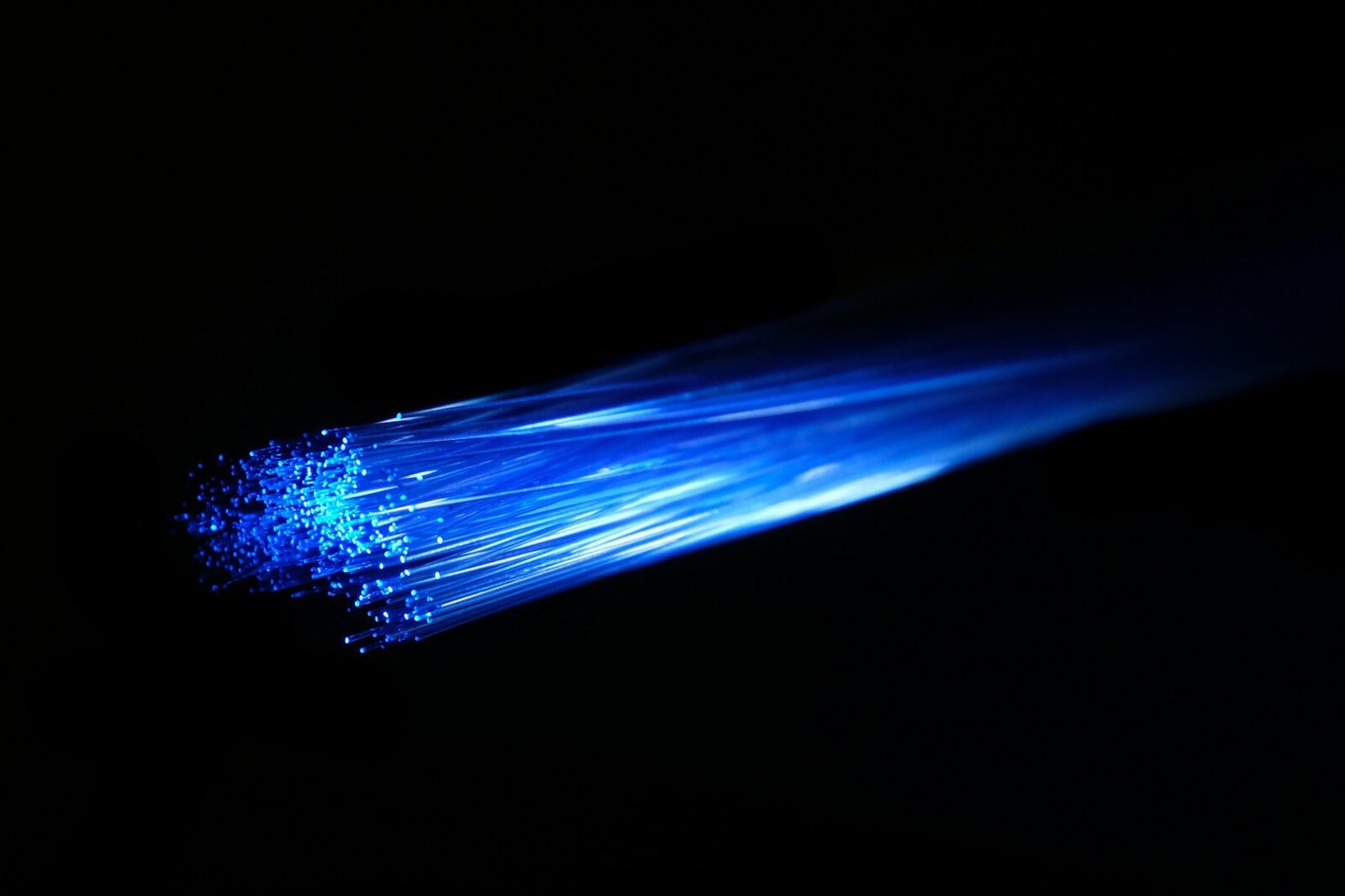 Blue fiber-optic strands carrying light